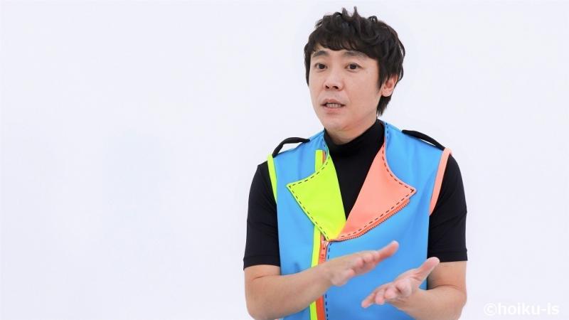 インタビューに答える体操の「よしお兄さん」