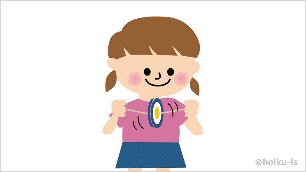 ぶんぶんゴマを回す女の子