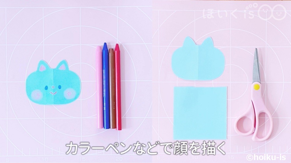 カラーペンなどでネコの顔を描く場面