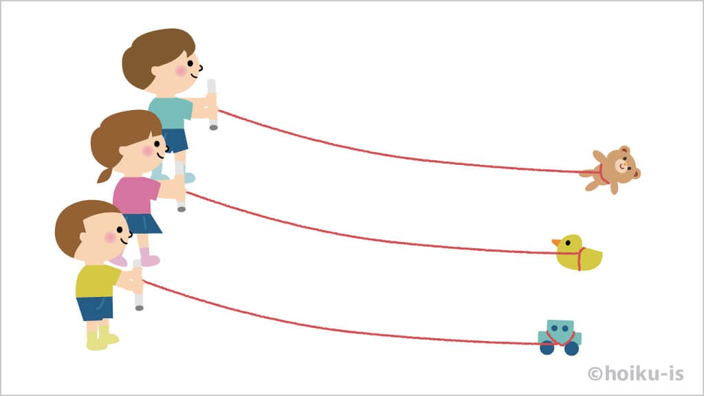 糸巻き競争の準備をする子どもたち