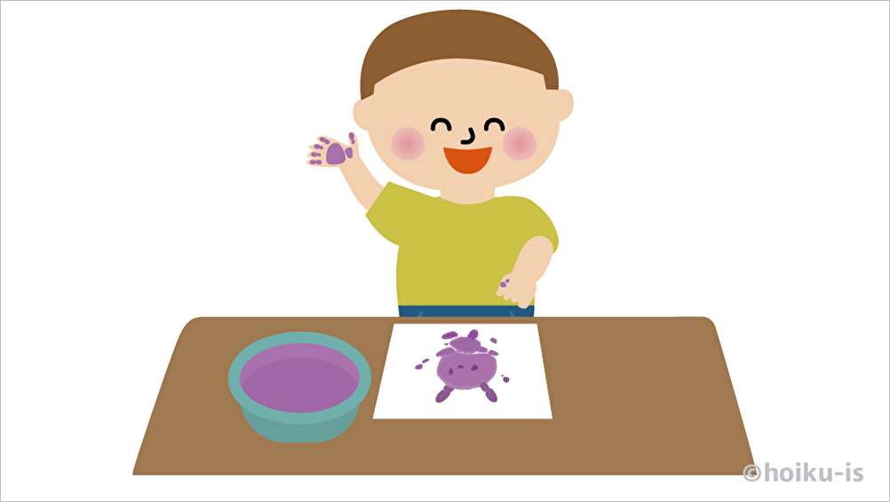 フィンガーペイントで絵を描く子ども
