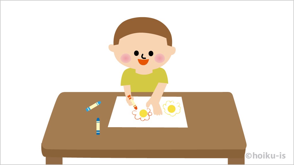 シールを貼った周りに絵を描く子ども