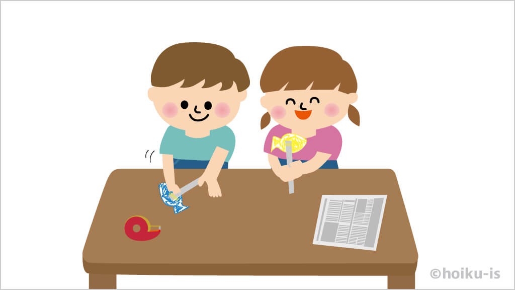 新聞紙のステッキに魚のイラストを貼り付ける子どもたちのイラスト