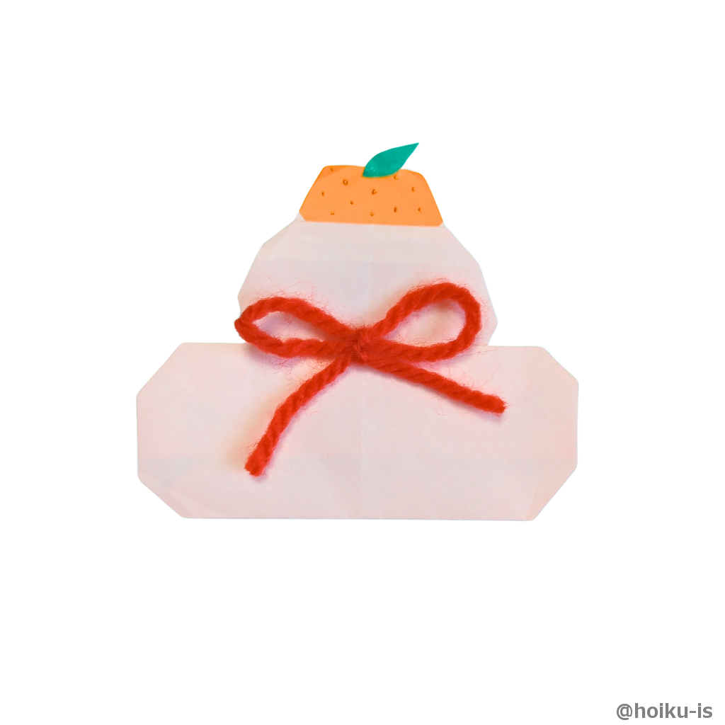 ⑲みかんの葉っぱや水引に見たてた毛糸を飾ってできあがり